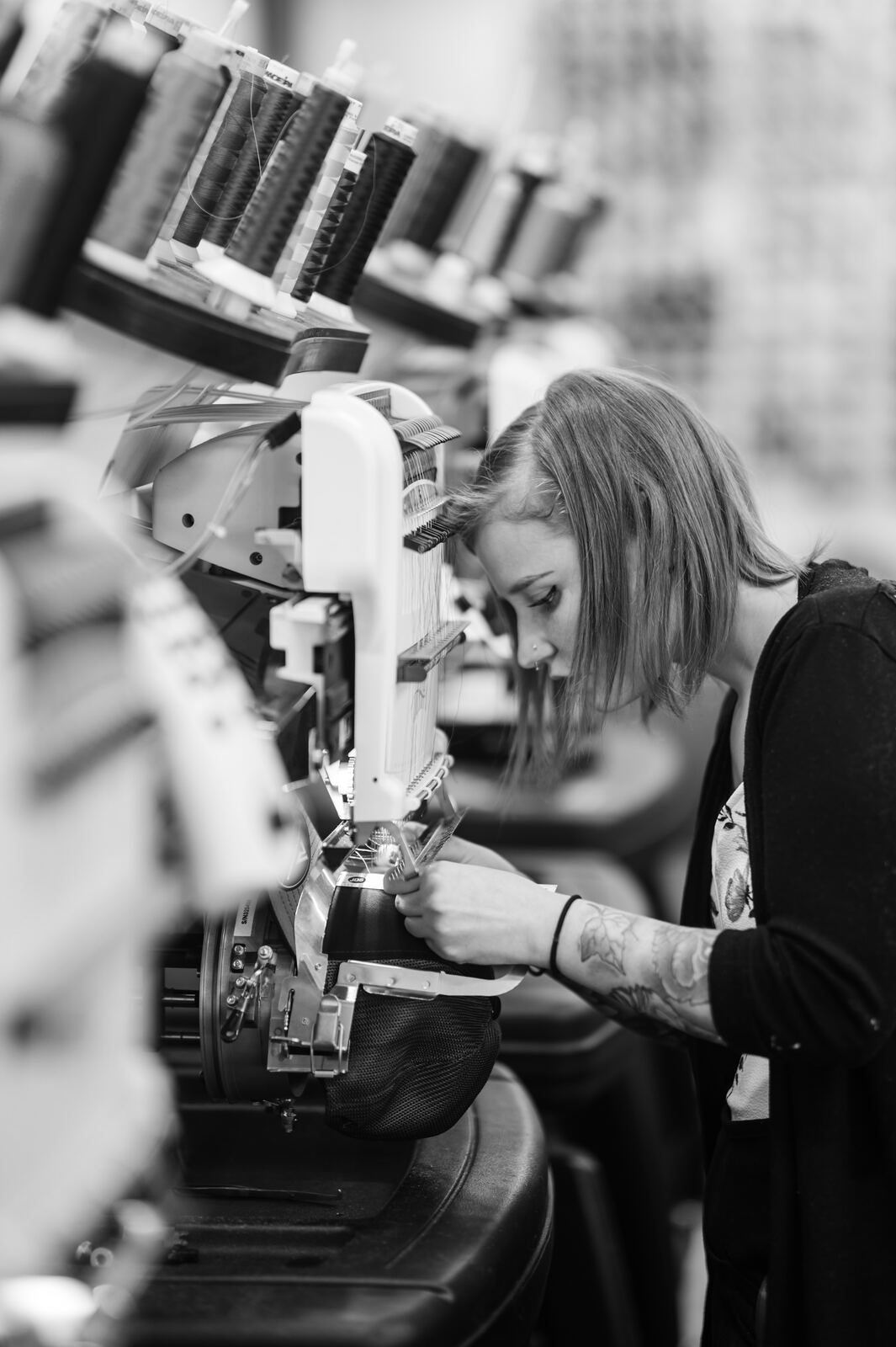 Hooping a hat on the embroidery machine at P&M Apparel